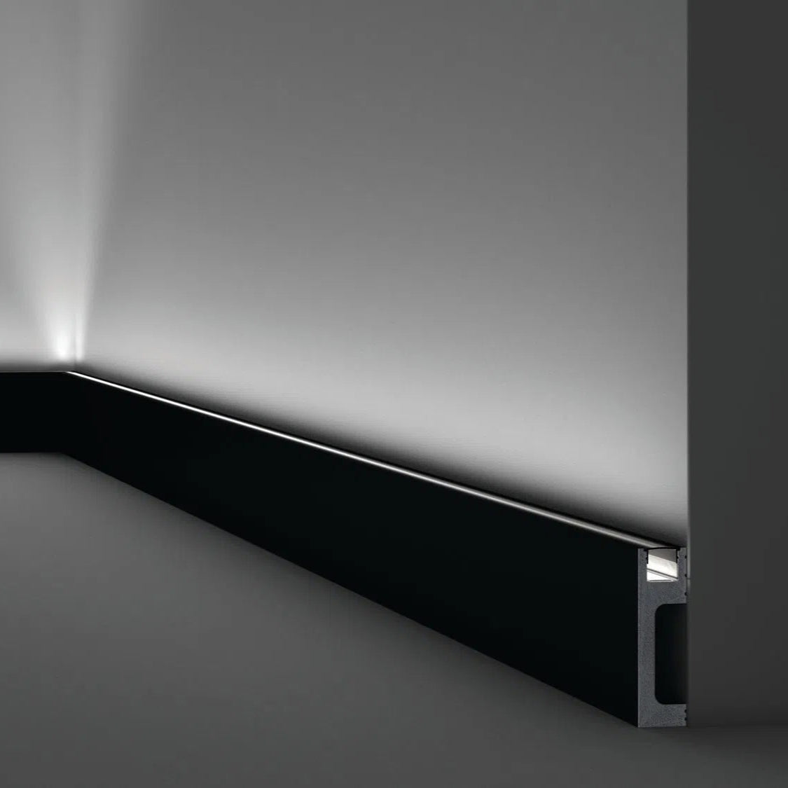 IL10 2M BLACK WALLSTYL SKIRTING BOARD - Skirtings with cable channel owner detail on a light-colored wall | DecorMania UK